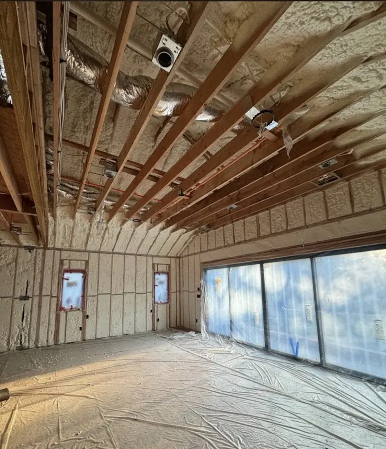 Interior walls and ceiling insulated with spray foam during new construction in Lake Los Angeles